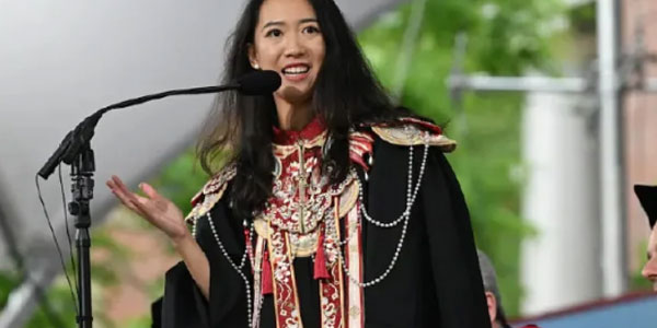 What’s Going On with the Female Speaker’s Cloud Shoulder at This Year’s Harvard Commencement?